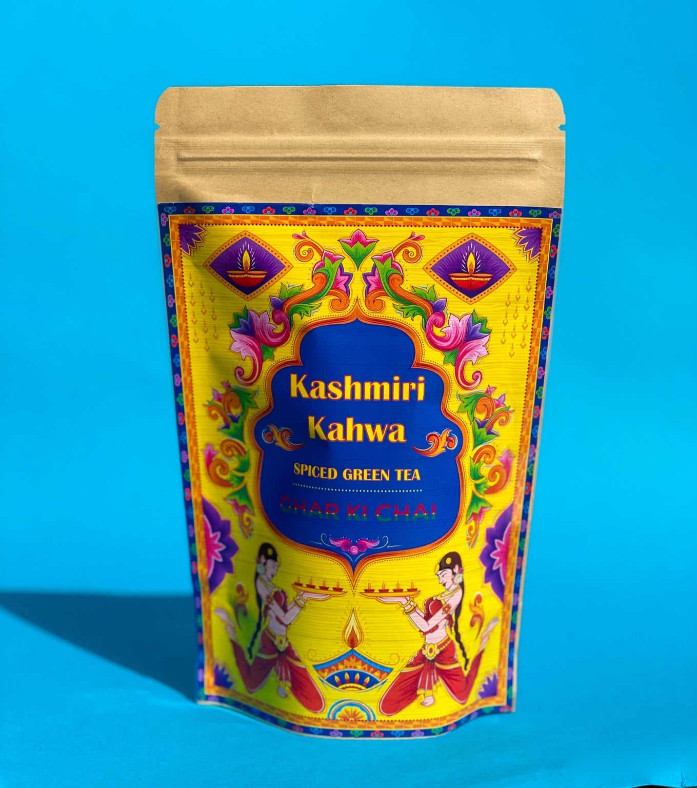 Ghar Ki Chai Kashmiri Kahwa pouch photographed against a vivid blue background