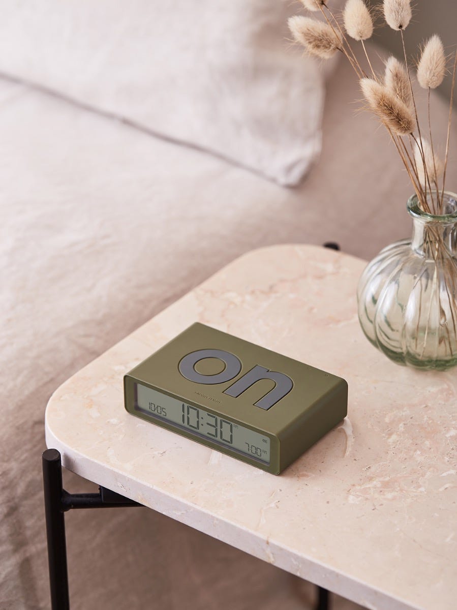 Lexon Flip Classic alarm clock on a bedside table for a September reset