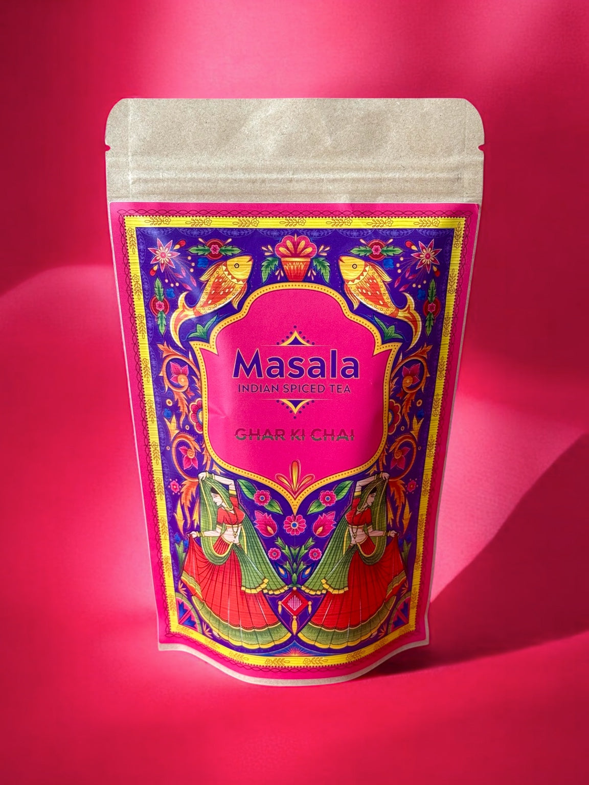 Ghar Ki Chai Masala packet on a vivid pink background